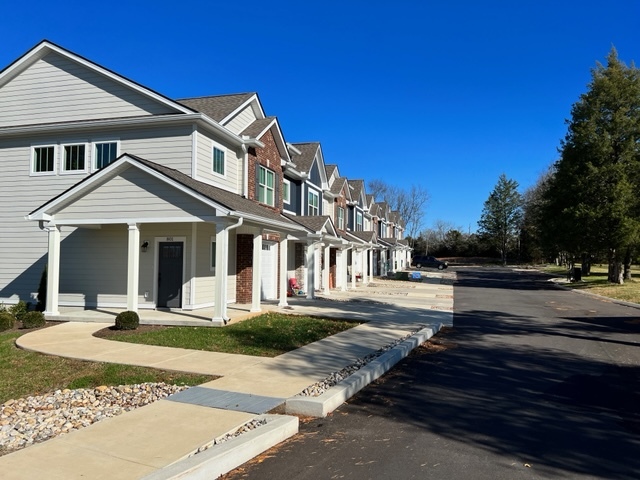 View from the street. 817 is the last townhouse at the far end. - 817 Coles Ferry Pike