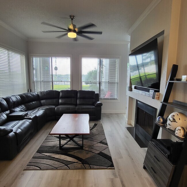 Living room overlooking lake - 3127 W Sligh Ave