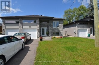 Building Photo - 8009-8009 Jeanne D'Arc Blvd N