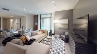 This single-floor residence showcases a contemporary design with a cohesive neutral palette and upscale finishes throughout. The kitchen is a standout space, featuring dark espresso cabinetry extending to the ceiling, light granite countertops, a stone tile backsplash, stainless steel appliances, and a peninsula with pendant lighting — combining style with functionality.

The living area opens directly to a private balcony through floor-to-ceiling sliding glass doors, flooding the space with natural light. Track lighting, warm gray tones, and hardwood-style flooring establish a modern, inviting ambiance. Adjacent to the living area, a dedicated study features built-in modular shelving and a collaborative workspace ideal for reading or remote work.

The primary bedroom offers a walk-in closet with floor-to-ceiling built-in shelving and double hanging rods. Its en-suite bathroom includes a double-sink vanity with granite countertops, a soaking tub, and a glass-enclosed walk-in shower. The second bedroom is bright with a large window, complemented by a sputnik-style light fixture. A second full bathroom features a dark vanity, granite countertop, and a tub-shower combination with clean tile surround.