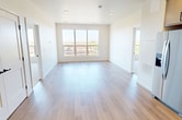 This contemporary apartment in Fargo, North Dakota, offers 940 square feet of thoughtfully designed living space. The layout includes two bedrooms, two full bathrooms, and an open-concept kitchen and living area. The primary bedroom is generously sized at 160 square feet, providing ample space for relaxation.

The interior boasts a fresh, modern aesthetic with neutral tones and clean lines. Large windows in the bedrooms and living area flood the space with natural light and offer scenic views of the surroundings. The flooring transitions seamlessly from warm hardwood in the main living areas to plush carpeting in the bedrooms, enhancing comfort and style.

The kitchen is a highlight, featuring sleek cabinetry, stainless steel appliances, and a stylish hexagonal tile backsplash. The bathrooms are well-appointed with modern vanities, illuminated mirrors, and spacious showers. Additional amenities include in-unit laundry facilities and ample closet space with wire shelving systems.

Located at 1321 17th Ave S in Fargo, this apartment combines urban convenience with contemporary design, making it an ideal choice for those seeking a comfortable and stylish living environment.
