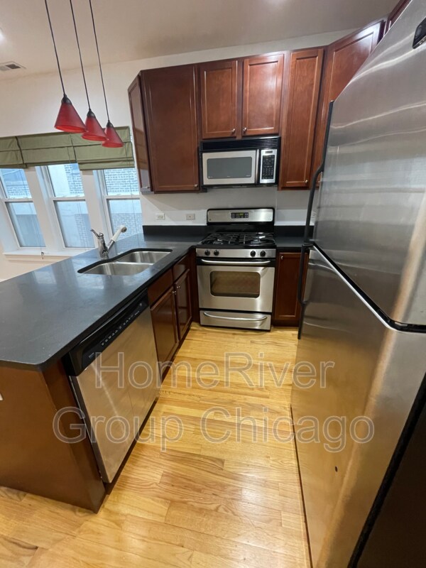 Foto del edificio - 6815 N Lakewood Ave