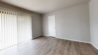 This 560 square foot apartment in Franklin, Wisconsin, presents a well-designed living space that maximizes functionality within its compact footprint. The single-floor layout comprises one bedroom, measuring 150 square feet, one bathroom, and a hallway, creating an efficient and easy-to-navigate home.

Upon entering, you're greeted by a bright and airy atmosphere, enhanced by the abundance of natural light filtering through windows and sliding glass doors. The apartment features modern, neutral-toned walls and sleek vinyl plank flooring throughout, providing a contemporary aesthetic and easy maintenance.

The kitchen area, while compact, is well-equipped with essential appliances and cabinetry, offering ample storage and preparation space. The living area, open to the kitchen, creates a sense of spaciousness and is ideal for both relaxation and entertaining.

The bedroom, at 150 square feet, comfortably accommodates a full-sized bed and essential furniture. It boasts a window with horizontal blinds, allowing for light control and privacy. The bathroom showcases a clean, white design with a combination tub and shower unit, perfect for both quick showers and relaxing baths.

Energy-efficient baseboard heating ensures comfort throughout the seasons, while the overall neutral palette allows residents to easily personalize the space to their taste. This apartment at 3635 W College Ave offers a perfect blend of comfort and convenience, ideal for individuals or couples seeking a low-maintenance, modern living space.