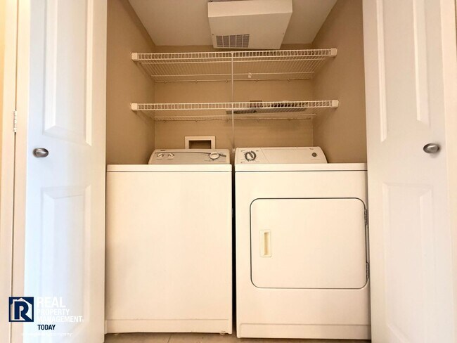 Building Photo - Prime Tacoma Narrows Condo with Covered Parking & Patio