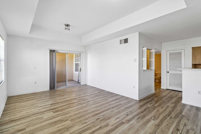 Building Photo - Spacious 1-Bedroom Condo for Annual Rent available now in gated Villagio Community