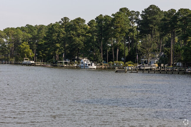 Along the banks of Herring Creek near Berlin, waterfront homes with private boat docks offer direct access to Cape Isle of Wight Bay and beyond.