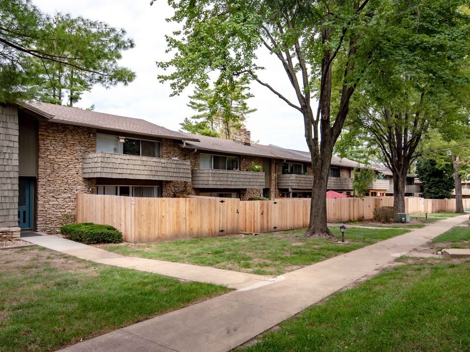 First floor units feature a fenced patio. - Corinth Valley