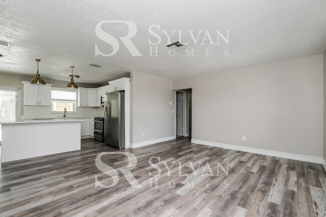 Building Photo - You Can Afford to Dwell Well.