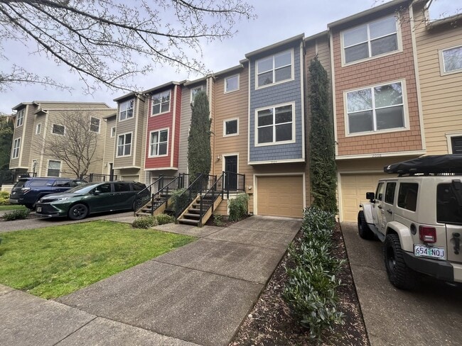 Building Photo - Beautiful 2 Bedroom Townhome with Walk-In Closets Private Deck & Attached Garage