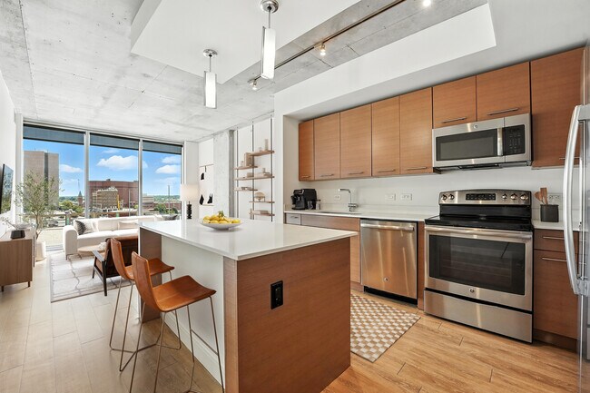 The kitchen of the 1B Den A3 floor plan at One Light Luxury Apartments - One Light Luxury Apartments