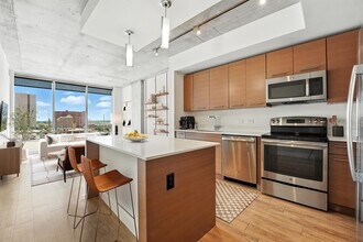 The kitchen of the 1B Den A3 floor plan at One Light Luxury Apartments - One Light Luxury Apartments