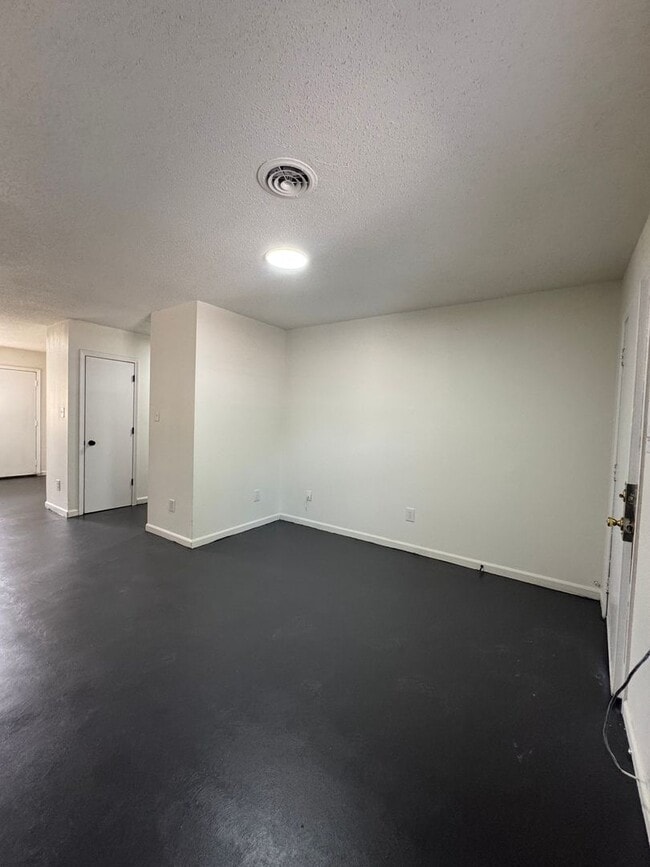 Building Photo - This freshly repainted and refreshed single-story brick duplex- End Unit