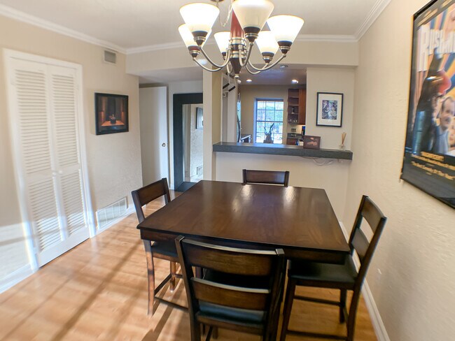The dining area connects to the kitchen with open bar. Great for hosting. - 2425 Ashdale Dr