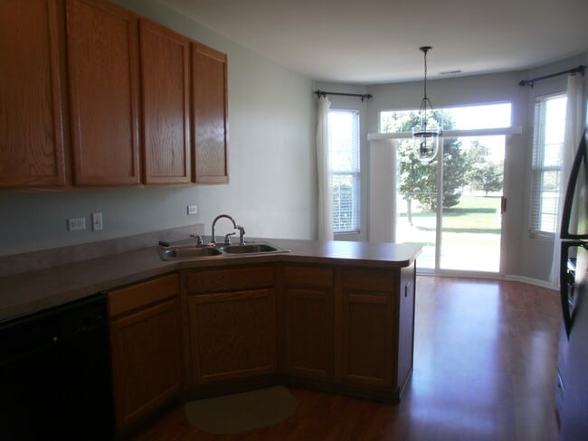 Dinning area with bay windows and door - 24341 Leski Ln