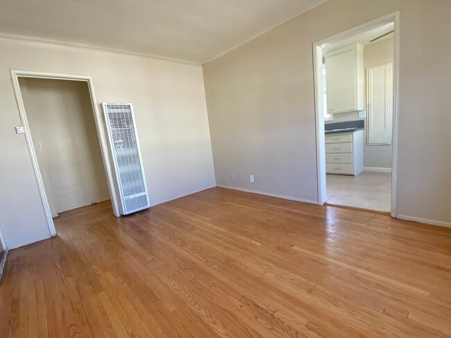 Living room with view into kitchen - 719 S Chapel Ave
