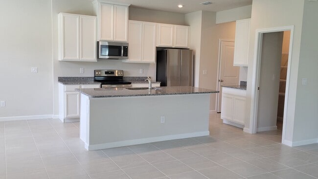 Building Photo - Annual UNfurnished NEW 4/ 2 1/2 home off S...