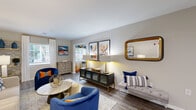 Located at 4048 Battleground Ave in Greensboro, NC, this single-floor residence offers a thoughtfully designed layout with 2 bedrooms, 2 bathrooms, an office, and a dedicated laundry room. The open-concept living, dining, and kitchen area serves as the heart of the home, featuring durable wood-look flooring, neutral walls, and multiple windows that bring in generous natural light. The kitchen stands out with white shaker cabinetry, granite countertops, a peninsula with a sink, and stainless steel appliances, opening directly to the dining nook for seamless entertaining. The living room provides a spacious, welcoming atmosphere with room for ample seating arrangements. The primary bedroom features plush carpet, a ceiling fan, and a window overlooking the outdoors, offering a comfortable retreat. The second bedroom and a separate office provide flexible options for guests or working from home. Both bathrooms are functional and clean, with one featuring a full tub-shower combination. Two closets offer practical storage throughout. The hallway connects all spaces efficiently, contributing to a cohesive and organized floor plan. Overall, this residence delivers a comfortable, functional living environment with modern finishes in a convenient Greensboro location.