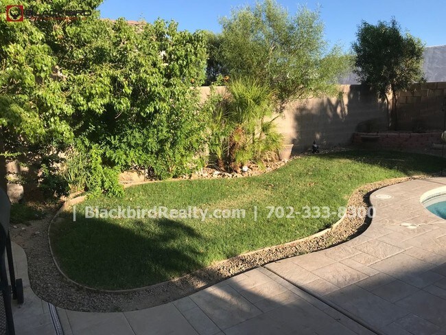 Building Photo - Rhodes Ranch  4 Bedrooms Pool  Guard Gated