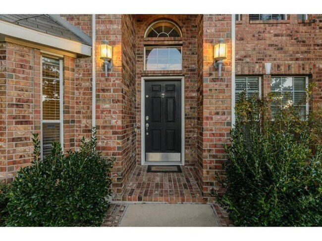 Building Photo - Elegant home with soaring ceilings, stone fireplace, chef’s kitchen, grand staircase, spacious be...