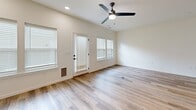 Located at 1924 Westboro Rd in Graymoor-Devondale, KY, this two-story home offers four bedrooms, four bathrooms, and a functional layout spread across two balanced floors. The open-concept kitchen is a standout feature, showcasing two-tone cabinetry with white upper cabinets and slate-gray lower cabinets, a classic subway tile backsplash, white quartz countertops, stainless steel appliances, and a center island with elegant gold pendant lighting — ideal for both everyday living and entertaining. The main level also includes a bright living area with light hardwood-style flooring, a ceiling fan, multiple windows with blinds, and a door providing direct outdoor access. Bathrooms are finished with clean white cabinetry, dark granite countertops, and light hardwood-style flooring, with one featuring a shower-tub combination. A dedicated laundry room houses a full-size GE washer and dryer. The bedrooms are generously proportioned, with several featuring plush carpet flooring, natural light from dual windows, and views of the surrounding neighborhood. The spacious primary bedroom includes a walk-in closet equipped with wire shelving and hanging rods. The home's neutral palette, modern fixtures, and practical layout make it a move-in ready residence.