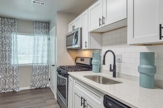 Kitchen with Tile Backsplash - Acclaim at  Carriage Hill