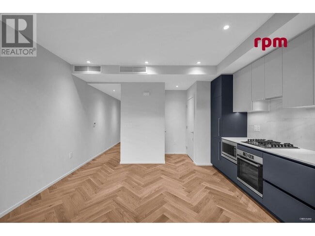Photo du bâtiment - 775-775 W 49th Ave