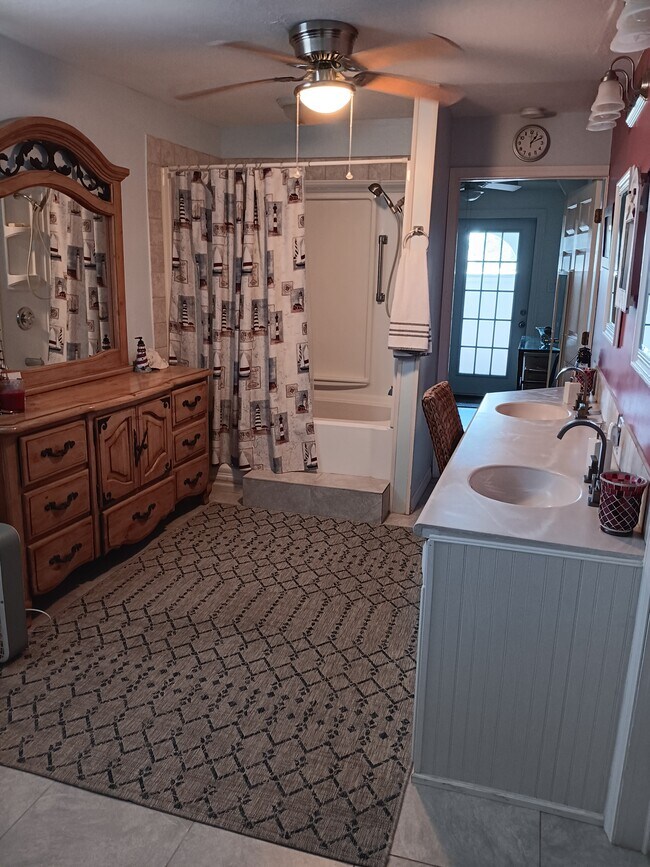 bathroom with deep tub & shower combo - 12890 Spencer St Apartments