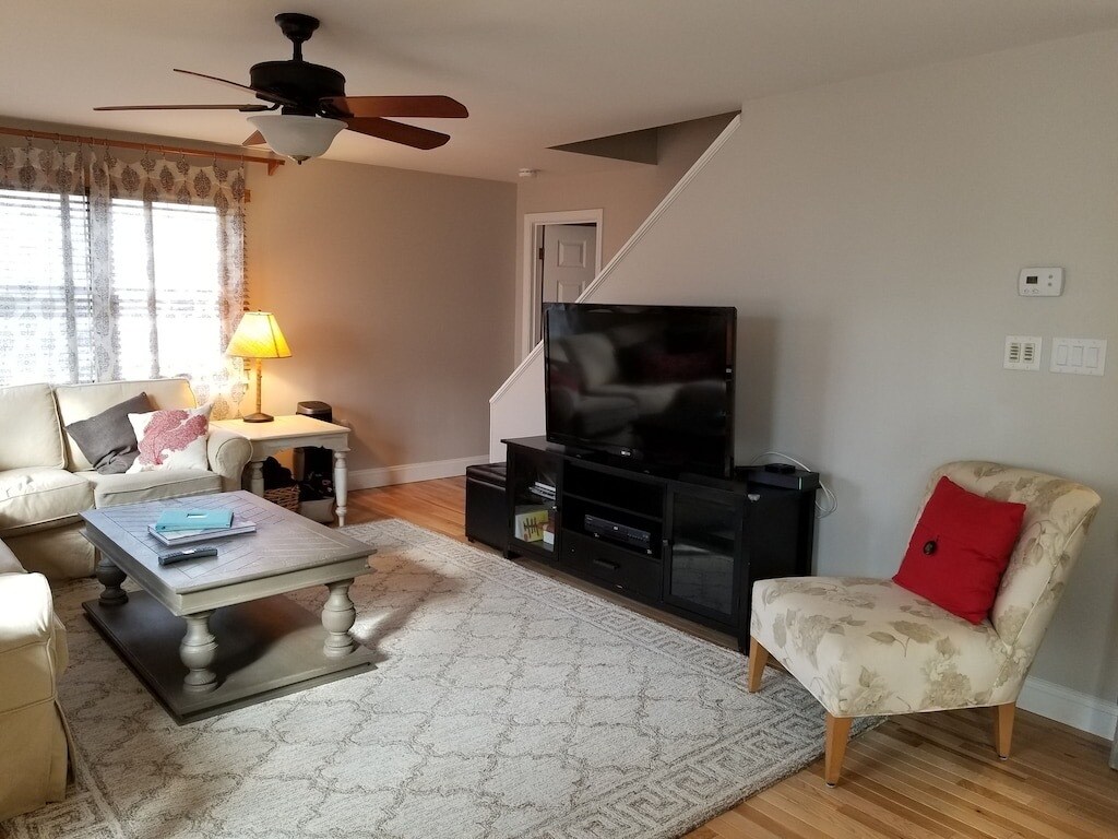 Open Living room with hardwood floors - 26 Shore St