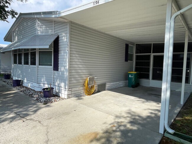 Building Photo - 2 BR 2 BATH Annual Rental in Barefoot Bay Available JUNE 2025