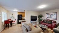This 680 square foot single-story residence in Fresno, CA offers a compact yet functional living space. The home features two bedrooms, including a primary bedroom of 150 square feet, and one bathroom. The interior showcases modern updates throughout, with tiled flooring as a consistent element.

The kitchen is a highlight, boasting wooden cabinetry, granite countertops, and black appliances. A small dining area adjoins the kitchen, creating an efficient eat-in space. The living room is comfortably furnished with a mix of seating options and decorated with contemporary artwork, adding character to the space.

Both bedrooms are equipped with simple, functional furniture and benefit from natural light through windows with blinds. The bathroom features marble-like tiled walls and a shower with a curtain for privacy.

Throughout the home, recessed lighting and ceiling fixtures provide ample illumination. The neutral wall colors create a bright, airy atmosphere, while the occasional pop of color in furnishings and decor adds visual interest.

Despite its modest size, the layout makes efficient use of the available space, creating a cozy yet uncluttered environment. This property would be well-suited for individuals or small families looking for a low-maintenance, updated living space in a convenient Fresno location.