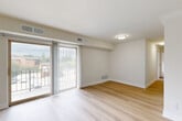 Located at 28 Fort Evans Rd NE in Leesburg, VA, this 2-bedroom, 2-bathroom residence offers a well-designed single-floor layout with a thoughtful mix of comfort and functionality. The living room is a bright, open space anchored by light-toned hardwood-style flooring and large sliding glass doors that open onto a private patio, filling the room with natural light and providing pleasant outdoor views. The adjacent dining area flows seamlessly from the living space, supporting an open and connected feel. The kitchen is outfitted with crisp white shaker cabinetry, a white subway tile backsplash, light quartz countertops, stainless steel appliances including a full-size refrigerator and dishwasher, and a pantry for added storage. Both bedrooms feature plush carpet flooring and ceiling fans, with the spacious primary bedroom offering generous closet space. The second bedroom benefits from a bright window with neighborhood views. Both bathrooms are finished in neutral tones with clean white vanities, modern brushed nickel fixtures, and mirrored medicine cabinets. With four closets distributed throughout, ample storage is a practical highlight of this well-appointed Leesburg residence.