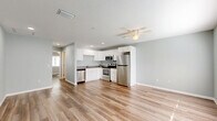 Located at 181 Dryden Pl in Brooksville, Florida, this well-designed one-bedroom, one-bathroom home makes excellent use of its single-floor layout. The open-concept living and kitchen area forms the heart of the home, where light-toned, wood-look plank flooring and soft sage-gray walls create a clean, welcoming atmosphere. A ceiling fan overhead adds both comfort and character to the space, while natural light filters in through a window near the front entry door.

The kitchen is efficiently appointed with white shaker-style cabinetry, ample upper and lower storage, a full suite of stainless steel appliances including a refrigerator, electric range, built-in microwave, and dishwasher, as well as a neutral countertop and recessed lighting.

The bedroom is a comfortably sized private retreat featuring natural light from a window with blinds and the notable convenience of dual closets, providing generous storage capacity. The bathroom is neatly finished with a full tub-and-shower combo, a white vanity, and consistent flooring throughout.

Additional highlights include a dedicated laundry area and a closet for extra storage. The consistent color palette and flooring throughout lend the space a cohesive, move-in-ready feel.