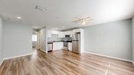 Located at 181 Dryden Pl in Brooksville, Florida, this well-designed one-bedroom, one-bathroom home makes excellent use of its single-floor layout. The open-concept living and kitchen area forms the heart of the home, where light-toned, wood-look plank flooring and soft sage-gray walls create a clean, welcoming atmosphere. A ceiling fan overhead adds both comfort and character to the space, while natural light filters in through a window near the front entry door.

The kitchen is efficiently appointed with white shaker-style cabinetry, ample upper and lower storage, a full suite of stainless steel appliances including a refrigerator, electric range, built-in microwave, and dishwasher, as well as a neutral countertop and recessed lighting.

The bedroom is a comfortably sized private retreat featuring natural light from a window with blinds and the notable convenience of dual closets, providing generous storage capacity. The bathroom is neatly finished with a full tub-and-shower combo, a white vanity, and consistent flooring throughout.

Additional highlights include a dedicated laundry area and a closet for extra storage. The consistent color palette and flooring throughout lend the space a cohesive, move-in-ready feel.