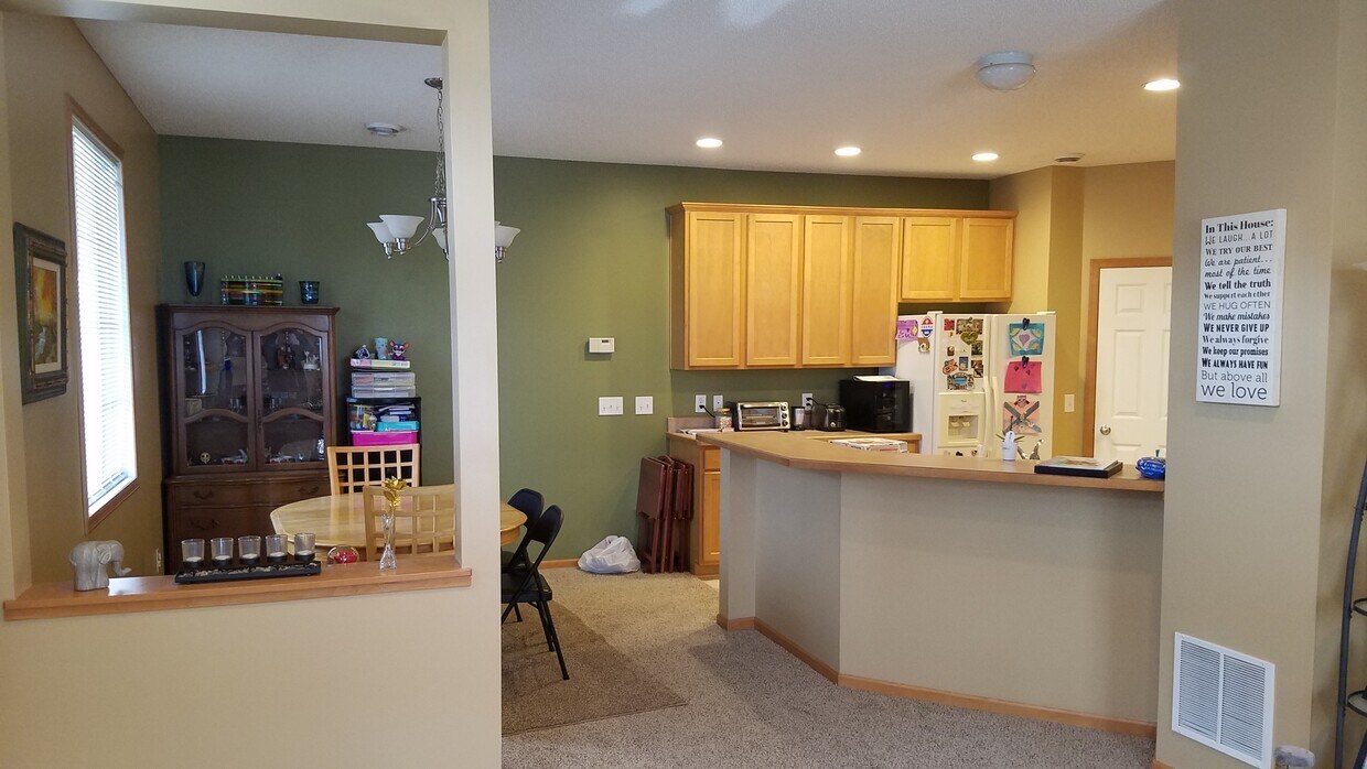 Dining Room and Kitchen from Living Room. Main Level, 9 foot ceiling. - 17195 Monroe Drive NW