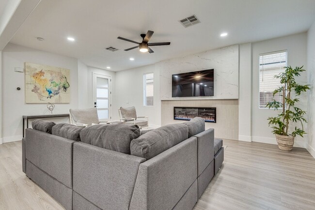 Building Photo - FULLY FURNISHED! Exudes sophistication with designer touches throughout