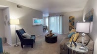 Located at 3634 Tupelo Ln in San Antonio, TX, this single-floor unit offers a well-organized and comfortable layout ideal for everyday living. The living room serves as the heart of the home, featuring plush wall-to-wall carpeting, neutral gray walls, and a textured ceiling. Large sliding glass doors flood the space with natural light and provide access to the outdoors, while a pass-through opening connects seamlessly to the dining and kitchen areas, creating an open and connected feel. The galley-style kitchen is efficiently designed with rich dark wood cabinetry, ample counter space, wood-look flooring, and a full suite of appliances including a range and refrigerator. Adjacent to the kitchen, the dedicated dining area is bright and inviting, featuring wood-look flooring, large windows with sheer curtains, and enough space for a full dining table and chairs. The bedroom is a restful retreat with soft carpeting, a ceiling fan with light fixture, and a calm, neutral color palette. The bathroom features a full tub-shower combination with clean white tile surround and wood-look flooring. Throughout the unit, a consistent teal and yellow accent color scheme lends a cohesive, welcoming ambiance.