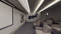 This private movie theater is designed to deliver an upscale cinematic experience within a refined, modern setting. The single-level space is arranged with tiered rows of generously sized, tufted lounge chairs upholstered in soft neutral fabric, ensuring comfortable sightlines to the large retractable projection screen positioned at the front of the room. A ceiling-mounted projector provides a high-quality viewing experience, while the room's layout accommodates a generous number of guests across multiple elevated rows.

The interior design follows a cohesive gray palette, with soft carpeted floors, neutral-toned walls, and a coffered ceiling featuring elegant recessed LED strip lighting that runs the length of the room, casting a warm, ambient glow. Sleek black wall sconces are symmetrically placed along the rear and side walls, contributing to the intimate theater atmosphere.

Distinctive decorative elements include a striking large-scale owl portrait artwork displayed as a diptych near the screen, complemented by a curated arrangement of dark circular wall sculptures in varying sizes. A smart control panel near the entrance allows for convenient management of the room's systems, and the space is accessible through a dedicated doorway, reinforcing its function as a self-contained, purpose-built screening room.