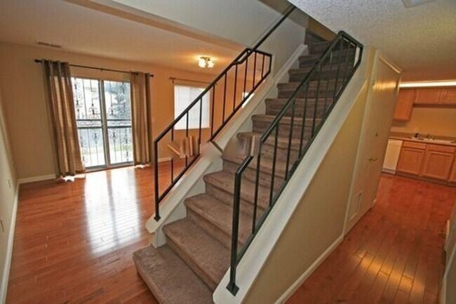 Building Photo - Deer Run attached home with yard, 2-car ga...