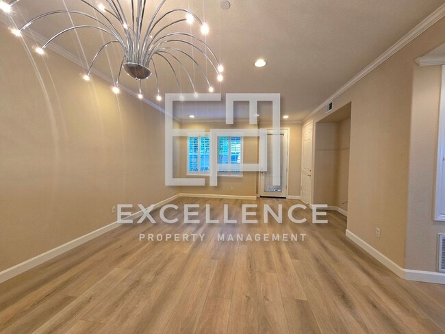 Building Photo - Fabulous 2/2 Condo with 2 Car Tandem Garage, New Floors Throughout, Views From Bedrooms, W/D, Pet...