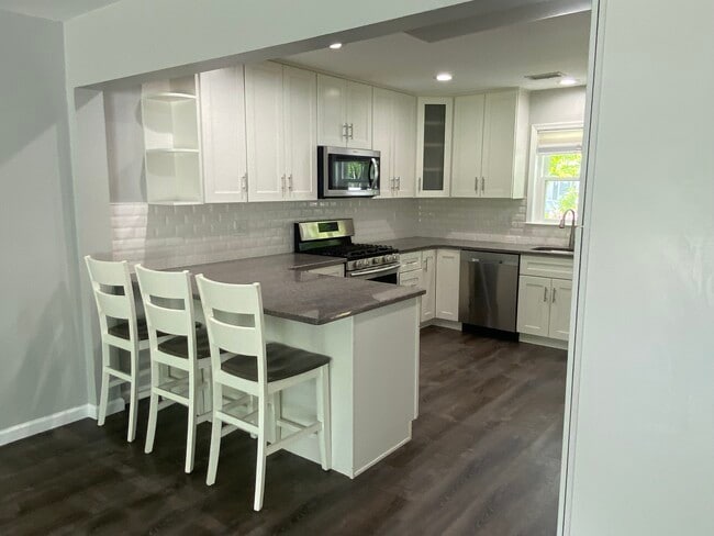 Open concept kitchen with island - 135 Baron Ln