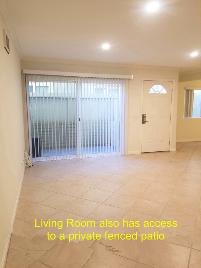 Living room also has access to private fenced patio - 4100 Patrice Rd