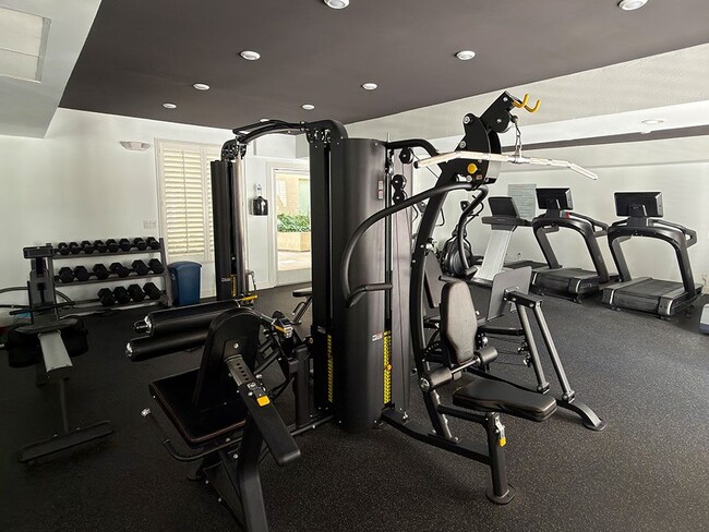 Fitness Center with Weight Machines, Treadmills, and Bikes. - Palms Court