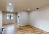 Located at 1619 Bridle Path Place in Stockton, CA, this single-story 2-bedroom, 1-bathroom home offers a thoughtfully designed layout with consistent finishes throughout. The living room serves as the heart of the home, showcasing light wood-style flooring, crown molding, recessed lighting, and a sleek black fireplace with a dark granite hearth. A sliding glass door opens directly to a private outdoor area, filling the space with natural light and providing convenient outdoor access.

The kitchen is well-equipped with white shaker-style cabinetry, dark granite countertops, and a full suite of stainless steel appliances, including a range, microwave, dishwasher, and refrigerator. Light wood flooring continues seamlessly from the living areas into the kitchen.

Both bedrooms feature plush carpeting and crown molding, with each room offering a dedicated closet. The primary bedroom includes a ceiling fan, a window with natural light, and a walk-in closet with built-in shelving. The second bedroom also benefits from natural light and its own closet with shelving.

The bathroom is efficiently laid out with a dark granite vanity, white cabinetry, a glass-enclosed shower and tub combo, and light wood-style flooring that ties the space together cohesively.