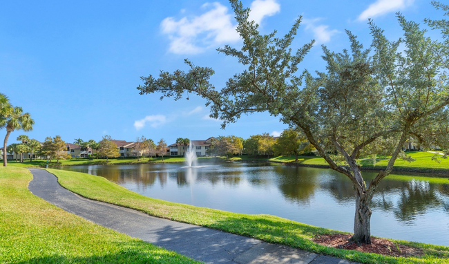 Lake view with walking path - Boca Arbor Club Apartments