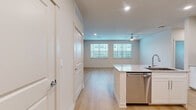 Located at 11305 Grant Rd in Houston, TX, this thoughtfully designed one-bedroom, one-bathroom unit offers a clean, modern aesthetic throughout its single-floor layout. Light-toned hardwood flooring runs continuously across every room, creating a bright and cohesive feel.

The combined kitchen and living area serves as the heart of the unit. The kitchen is outfitted with crisp white shaker cabinetry, a subway tile backsplash, stainless steel appliances including a French door refrigerator, range, and microwave, and a granite-topped island with an undermount sink — ideal for both cooking and casual dining.

The living area benefits from multiple windows fitted with blinds, allowing ample natural light while maintaining privacy. Ceiling fans are present in the living and bedroom spaces, adding both function and comfort.

The bedroom is a well-proportioned retreat featuring a large window with exterior views and a dedicated walk-in closet equipped with wire shelving and hanging rods for generous storage.

The bathroom is finished with marble-look tile surround in the tub/shower combination, a white vanity with granite countertop, and warm recessed lighting that contributes to a clean, spa-like atmosphere.

Throughout, the unit maintains a neutral color palette with white trim and doors, giving it a fresh and move-in-ready character.