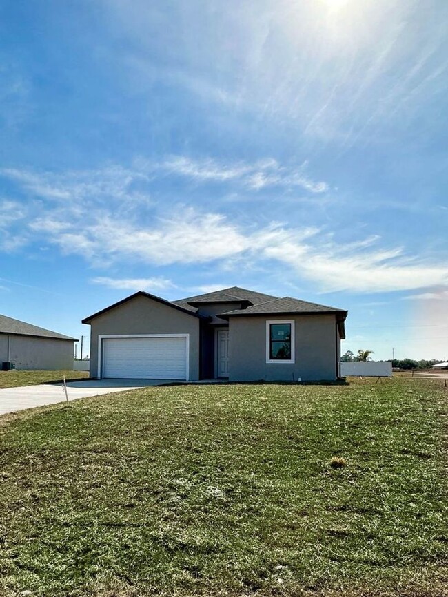 Building Photo - Newer Home with a Spacios open floor concept.