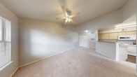 Located at 335 Cypress Creek Rd in Cedar Park, TX, this single-story residence offers a practical and comfortable layout across one bedroom and one bathroom. The combined kitchen and living area forms the heart of the home, with tile flooring at the entryway transitioning to plush carpet in the living space. Natural light filters in through blinded windows, creating a bright and welcoming atmosphere. The kitchen is well-equipped with light wood cabinetry, laminate countertops in an L-shaped configuration, a double-basin stainless steel sink, a dishwasher, electric range, microwave, and refrigerator, all complemented by warm hardwood-style flooring. The bedroom is a comfortable retreat featuring soft carpet, a ceiling fan with light fixture, a window with blinds for natural light and privacy, and a double-door closet providing ample storage. The bathroom includes hardwood-style flooring, a window for natural ventilation, and a bathtub with shower. Neutral tones and clean white trim throughout the space create a cohesive, move-in-ready aesthetic suited for those seeking an efficient and functional home in the Cedar Park area.