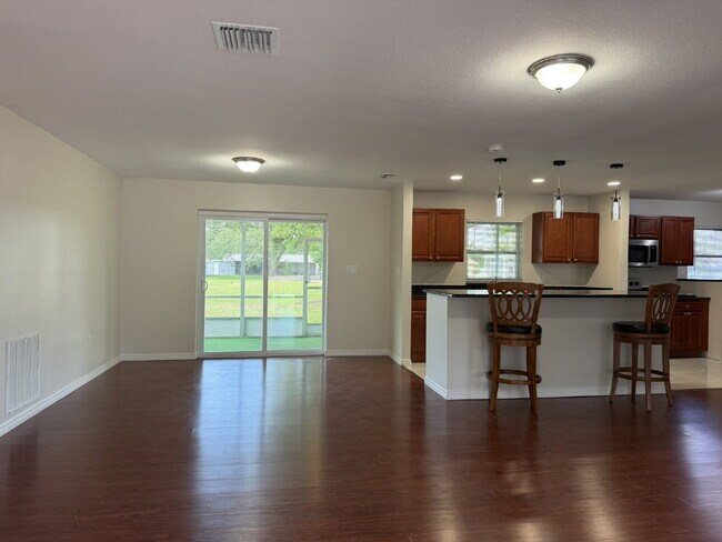 Building Photo - "Charming 3-Bedroom Home with Gleaming Hardwood Floors!"