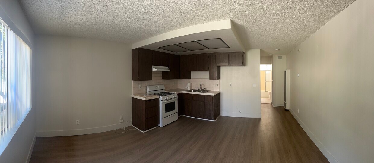 Living room and kitchen - 200 S Carondelet St
