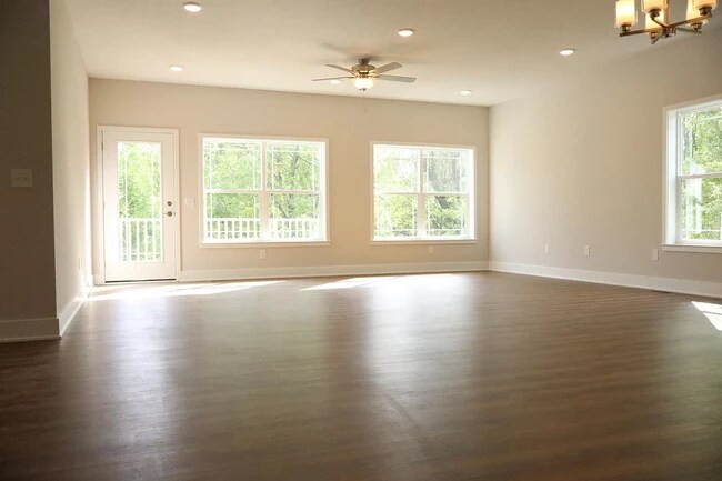 Living area with plank flooring - 6575 Clearwater Ct